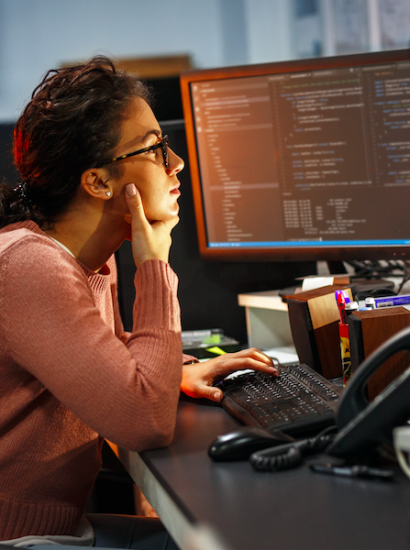 female software engineering student at computer