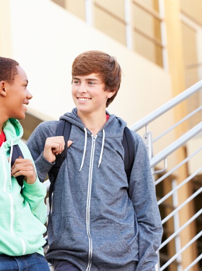 Students smiling on the stairs