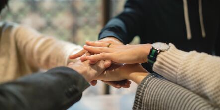 Hands together in a cheer