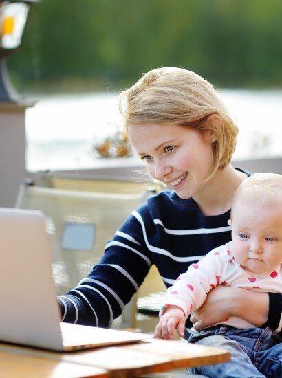 Mom working on homework with her baby