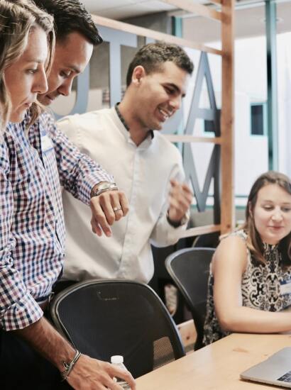 students standing around a computer
