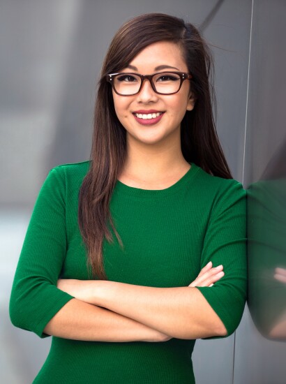 Student smiling outside