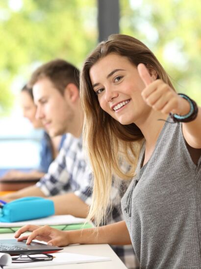 Girl giving a thumbs up.