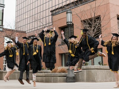Ensign College Graduates Leaping into Air