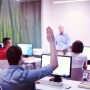 Student raising hand in class
