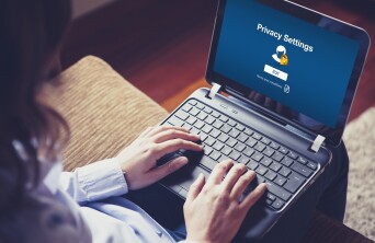 female accessing computer privacy settings