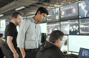Men working in a network and security office