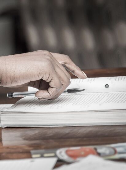 Hand on a textbook