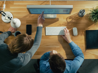 co-workers looking at same computer