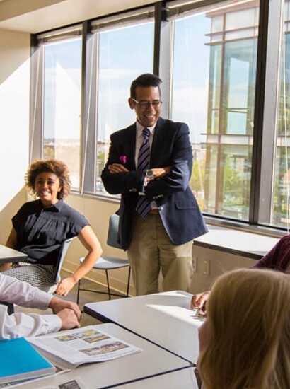 Teacher talking with students