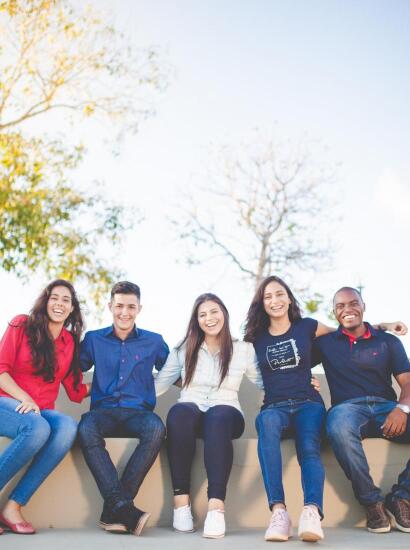 students smiling outside